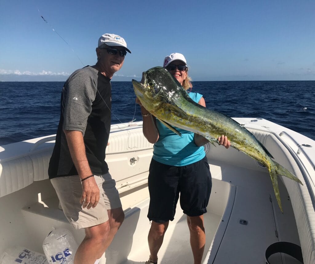 private fishing charters west palm beach fl - A group of people on a boat enjoying private fishing charters in West Palm Beac